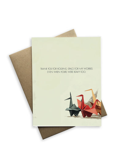 Greeting card with origami cranes and text on a white background