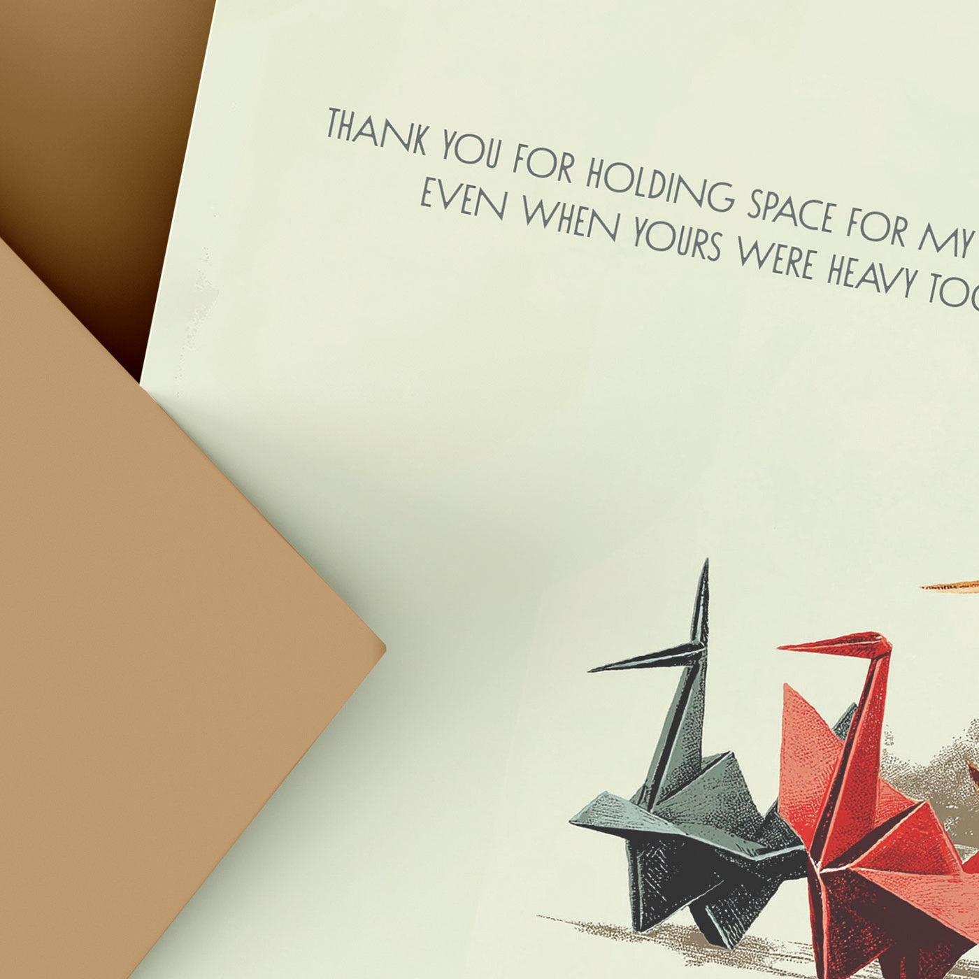 Card with origami cranes and a heartfelt message on a beige background