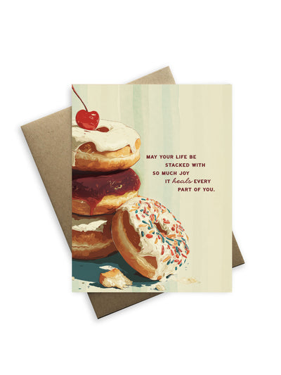 Greeting card with donut illustration and motivational quote on a white background