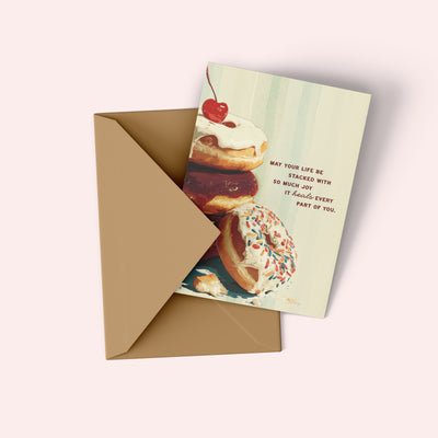 Greeting card with donut illustration and envelope on a white background