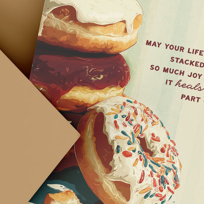 Stack of donuts with colorful glaze and a motivational quote on a textured background